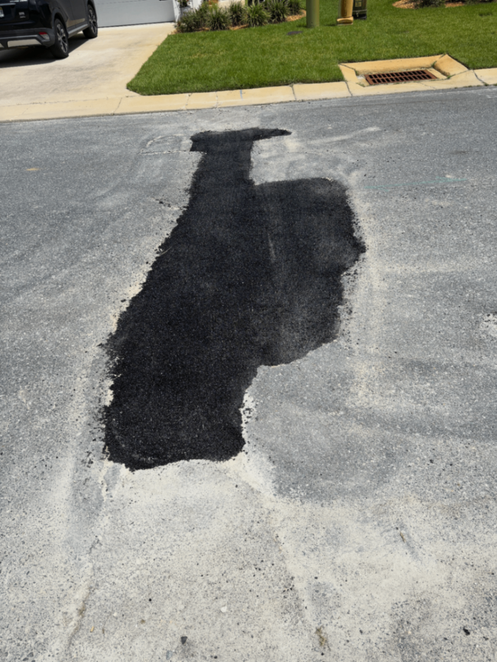 Completed road repair patch at Arrazo on Madison home development