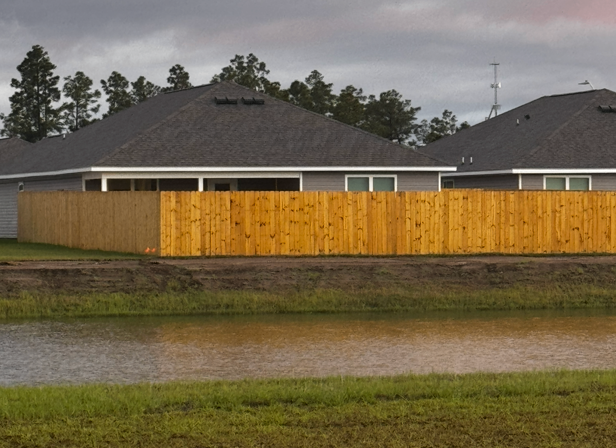 Completed wood fence installation at Morningside Development private residence