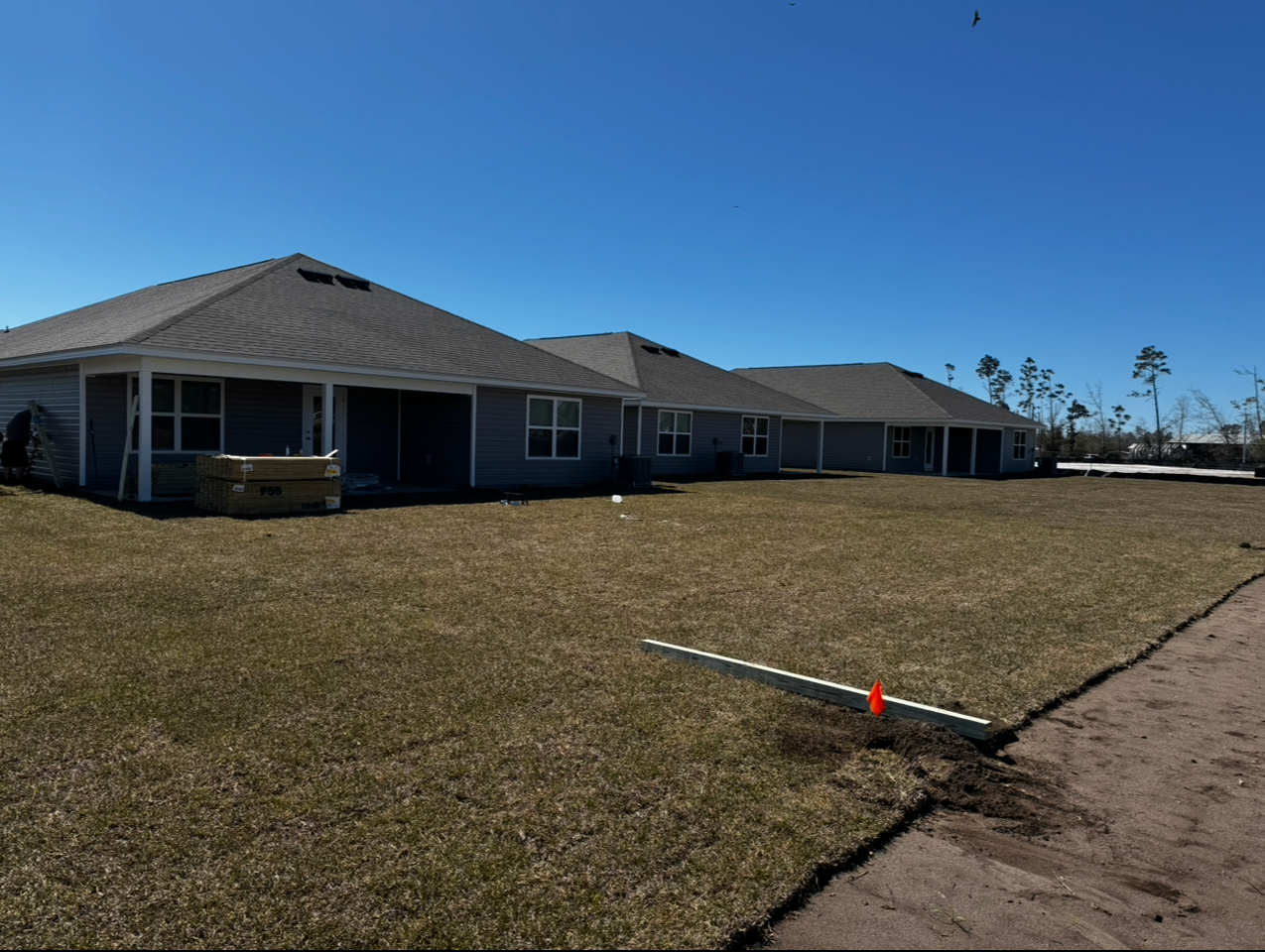 Backyard before wood fence installation at Morningside Development private residence